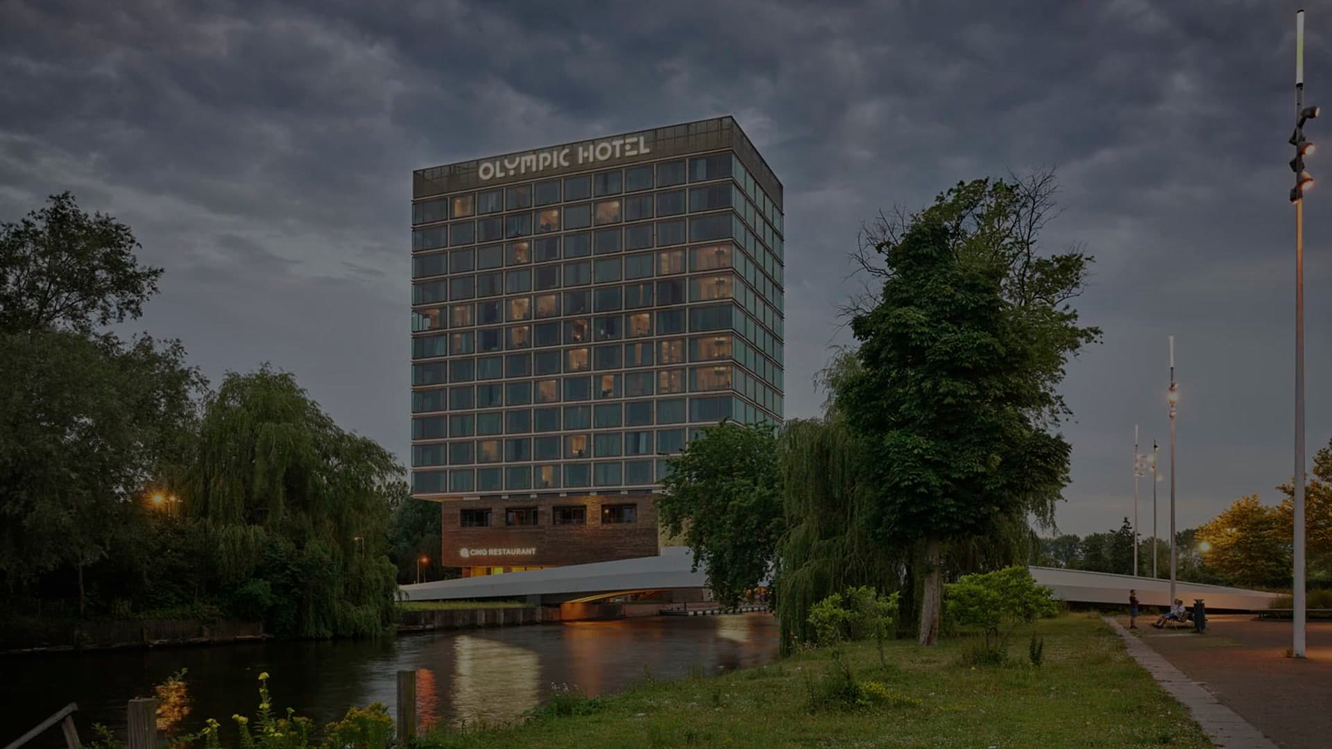 Olympic Hotel Amsterdam beside the Stadiongracht at dusk